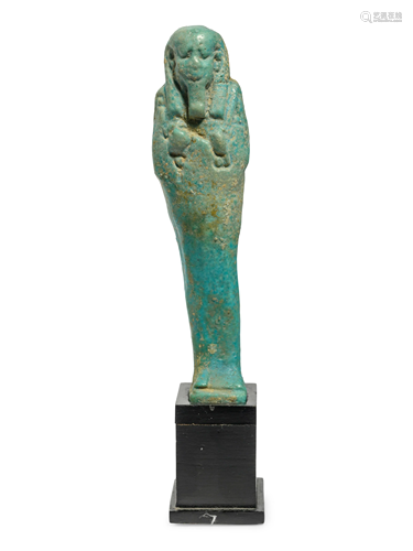 An Egyptian Faience Ushabti Height 4 inches.