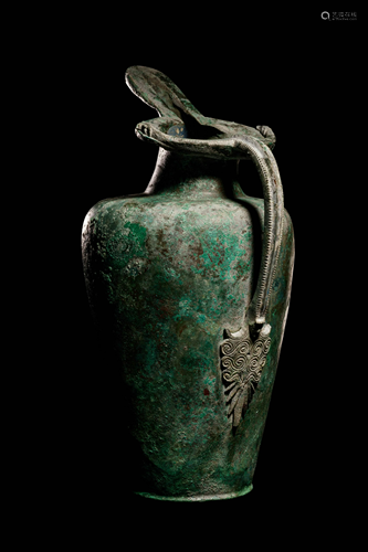 An Etruscan Bronze Oinochoe Height 12 1/2 inches.