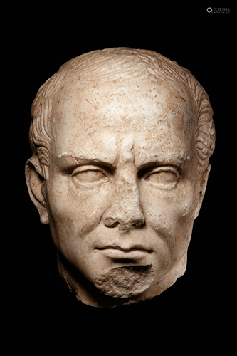 A Roman Marble Head of a Man Height 7 1/2 inches.