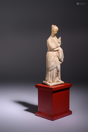 A Greek Terracotta Female with a Fan Height 8 inches.