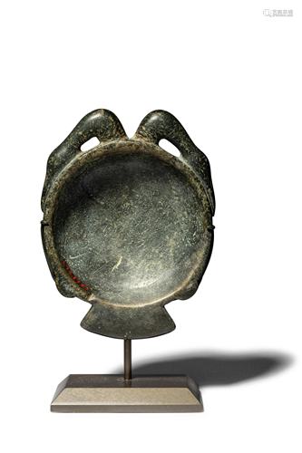 An Egyptian Stone Bowl or Palette in the Shape of a