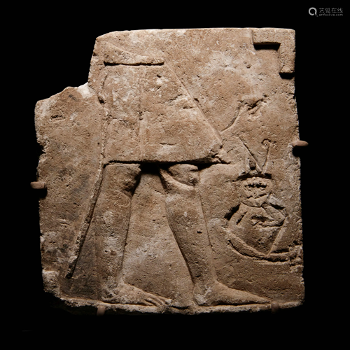 An Egyptian Limestone Sculptor's Model or Votive Relief