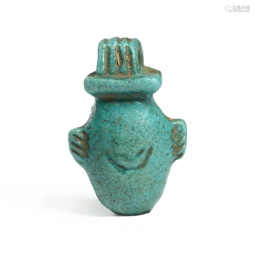 An Egyptian Faience Heart Amulet Height 7/8 inches.