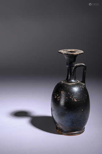 A Greek Black Glazed Lekythos Height 8 3/4 inches.