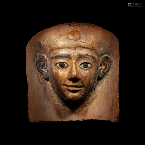 An Egyptian Cartonnage Mummy Mask Height 11 inches.