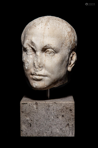 A Roman Marble Portrait Head of a Man Height 7 inches.