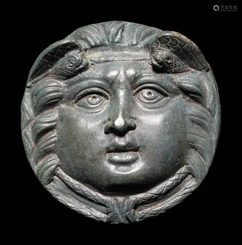 A Roman Bronze Roundel with Head of a Gorgon Diameter 2