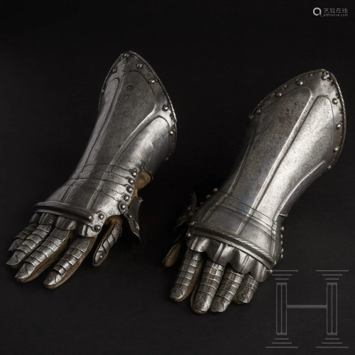 A pair of gauntlets with the original leather gloves,