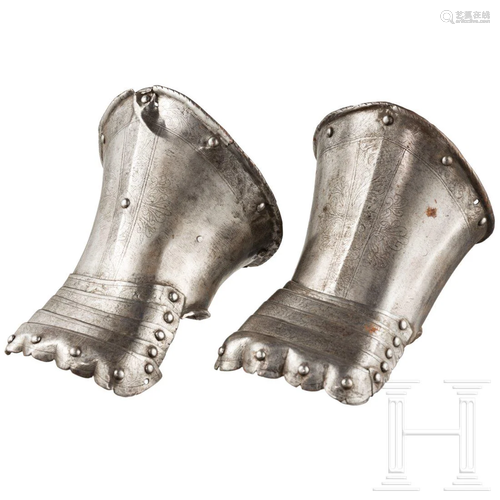 A pair of German gauntlets with later etched decor,