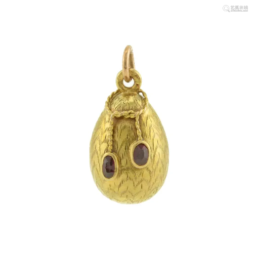 A Russian gold and ruby miniature pendant egg