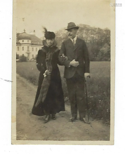 Photo of Maria Feodorovna walking arm in arm with a man