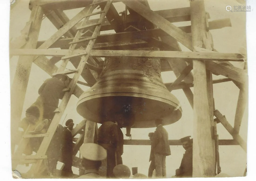 Photo of the hanging of a large church bell