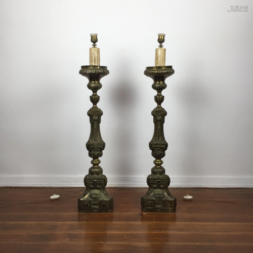 Pair of religious candlesticks in embossed bronze