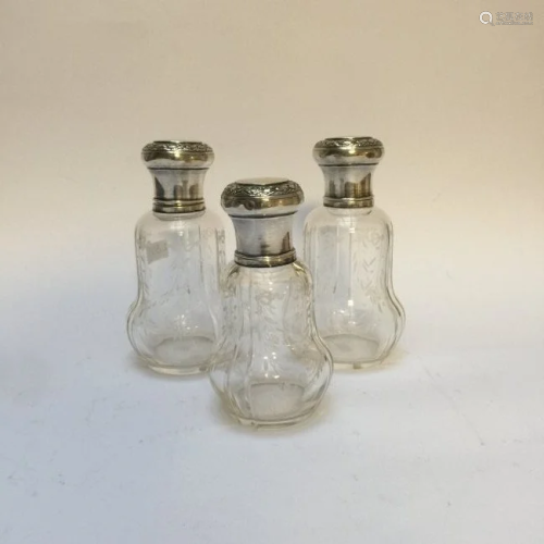 Set of three cut glass bottles