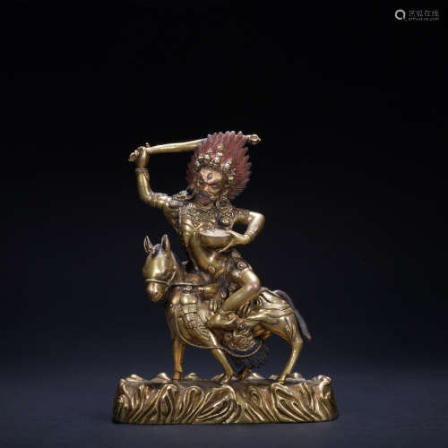A gilt-bronze statue of Mammon