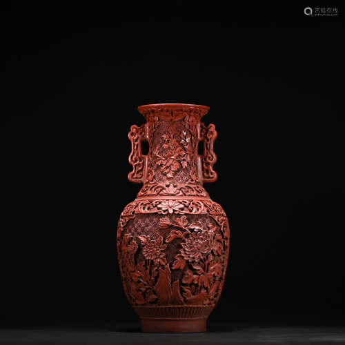 A carved lacquerware vase