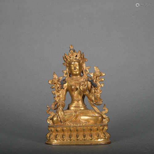 A gilt-bronze statue of Tara