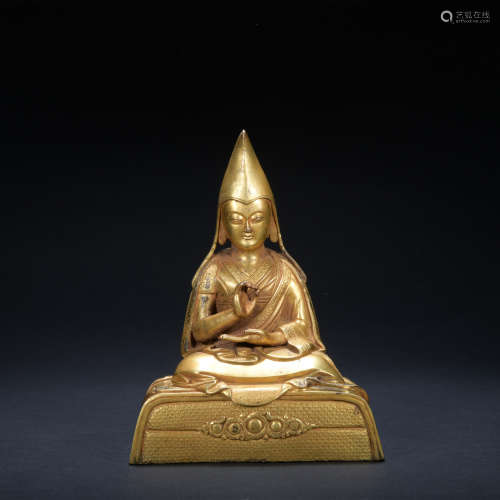 A gilt-bronze statue of Master Buddha