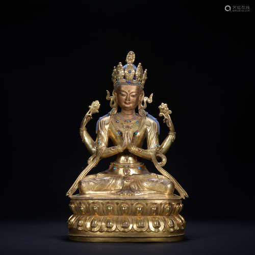 A gilt-bronze statue of four arm Avalokitesvara