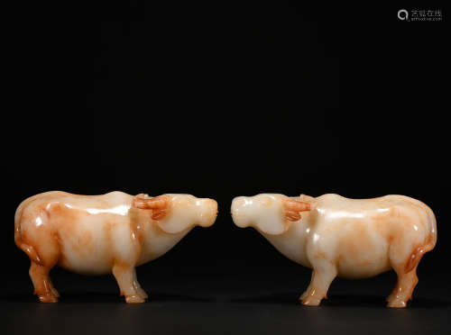 A pair of jade cattle