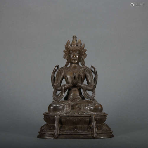 A bronze statue of Four arm Avalokitesvara