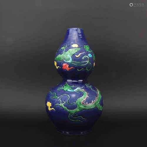 A blue glazed 'dragon and phoenix' gourd-shaped vase