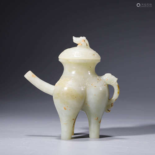 A carved white jade beast tripod wine vessel and cover