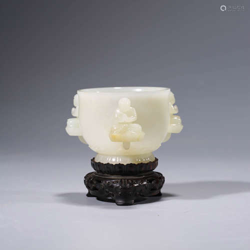 A carved white jade buddha cup and stand