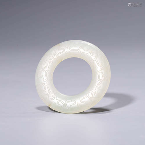 A carved white jade annular pendant