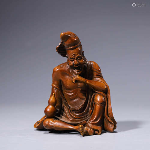 A boxwood carving of a figure jigong