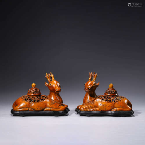 A pair of two wood deer incense burners