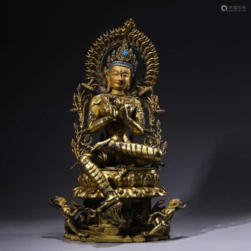 A gilt-bronze statue of green tara