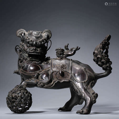 A bronze lion playing incense burner