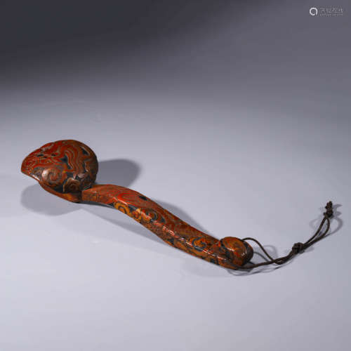 A carved lacquerware dragon ruyi scepter