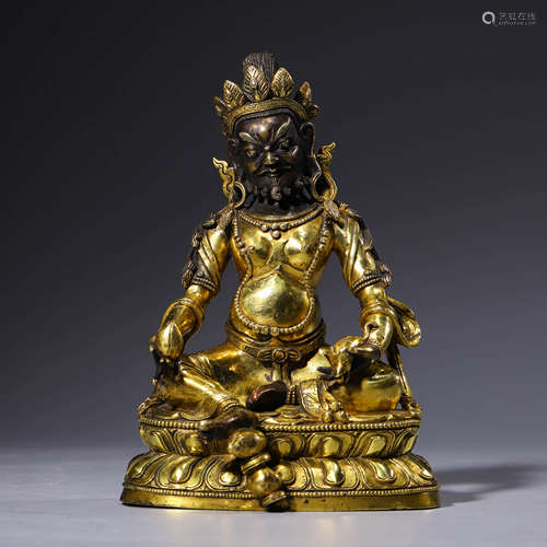 a gilt-bronze statue of yellow jambhala