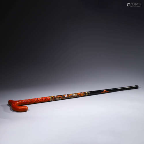 A cloisonne enamel and red lacquerware-tipped cane