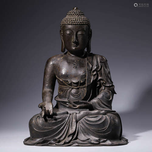 a bronze statue of shakyamuni