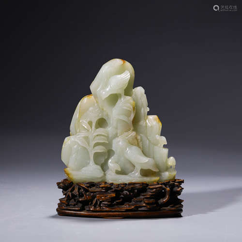 A carved white jade landscape boulder ornament