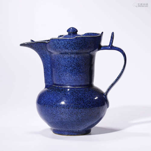 a blue-glazed incised dragon monk’s cap jug