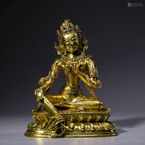 A gilt-bronze statue of green tara