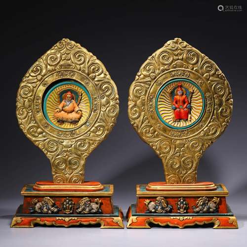 A pair of gilt-bronze buddha ornaments