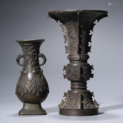 A pair of two archaistic bronze vases