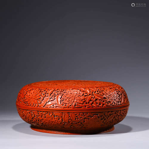 A carved cinnabar lacquerware circular floral box and cover