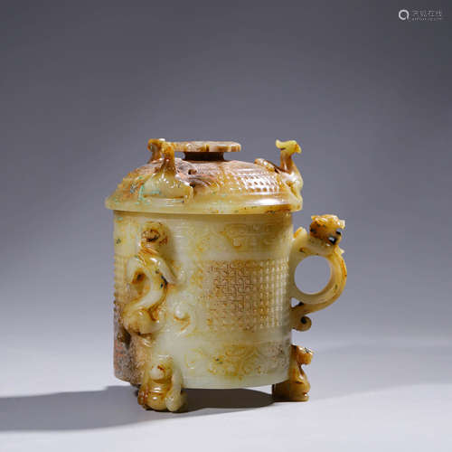 An archaistic carved russet jade dragon-eared cup