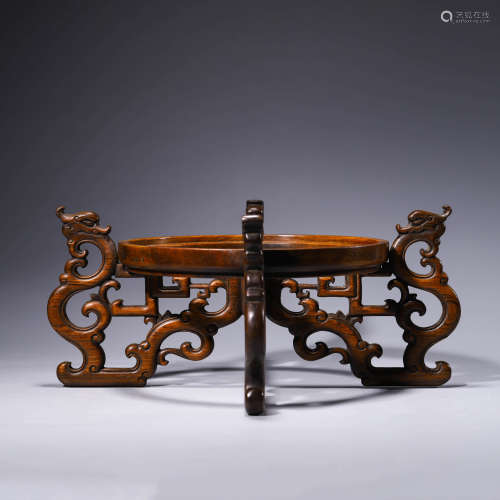 An openwork wood stand