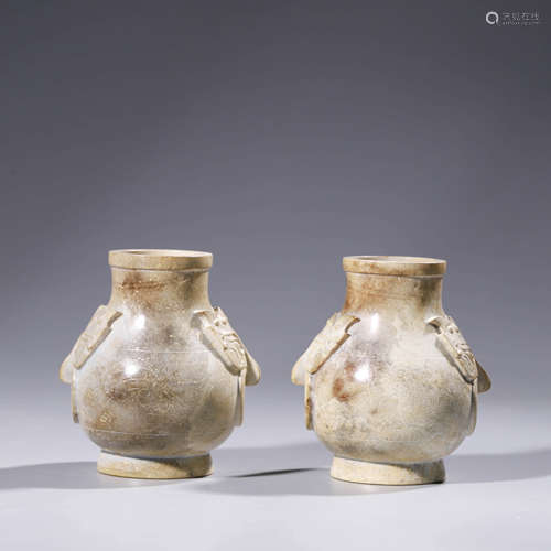 A pair of jade dragon and lion-eared vases