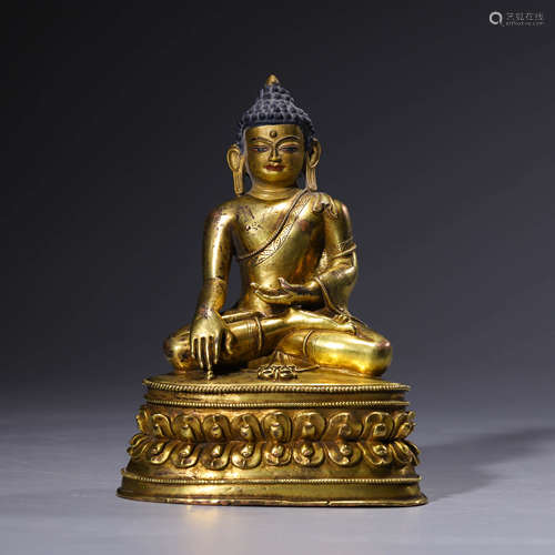 A gilt-bronze statue of Acalavajra