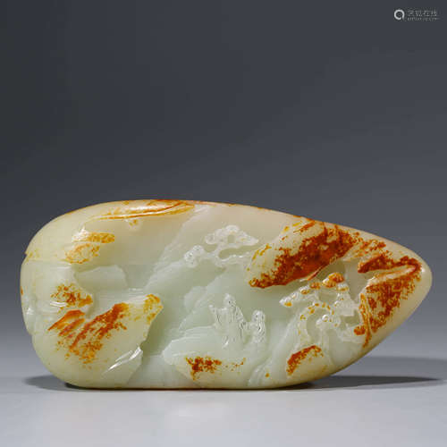 A carved celadon jade landscape boulder