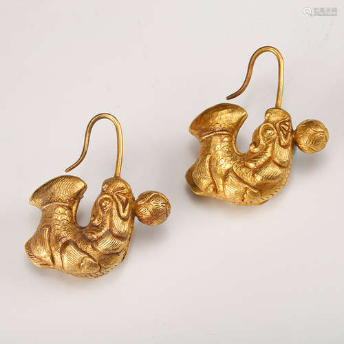 A Pair Of Gold Earrings