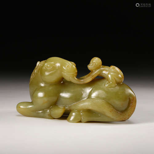 A Yellow Jade Monkey On Horse Back